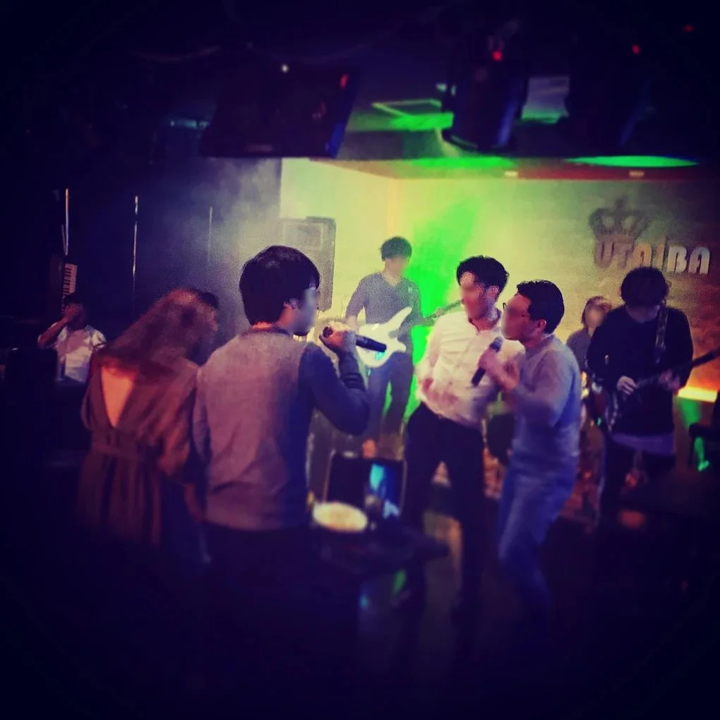 A counter bar lit by neon lights